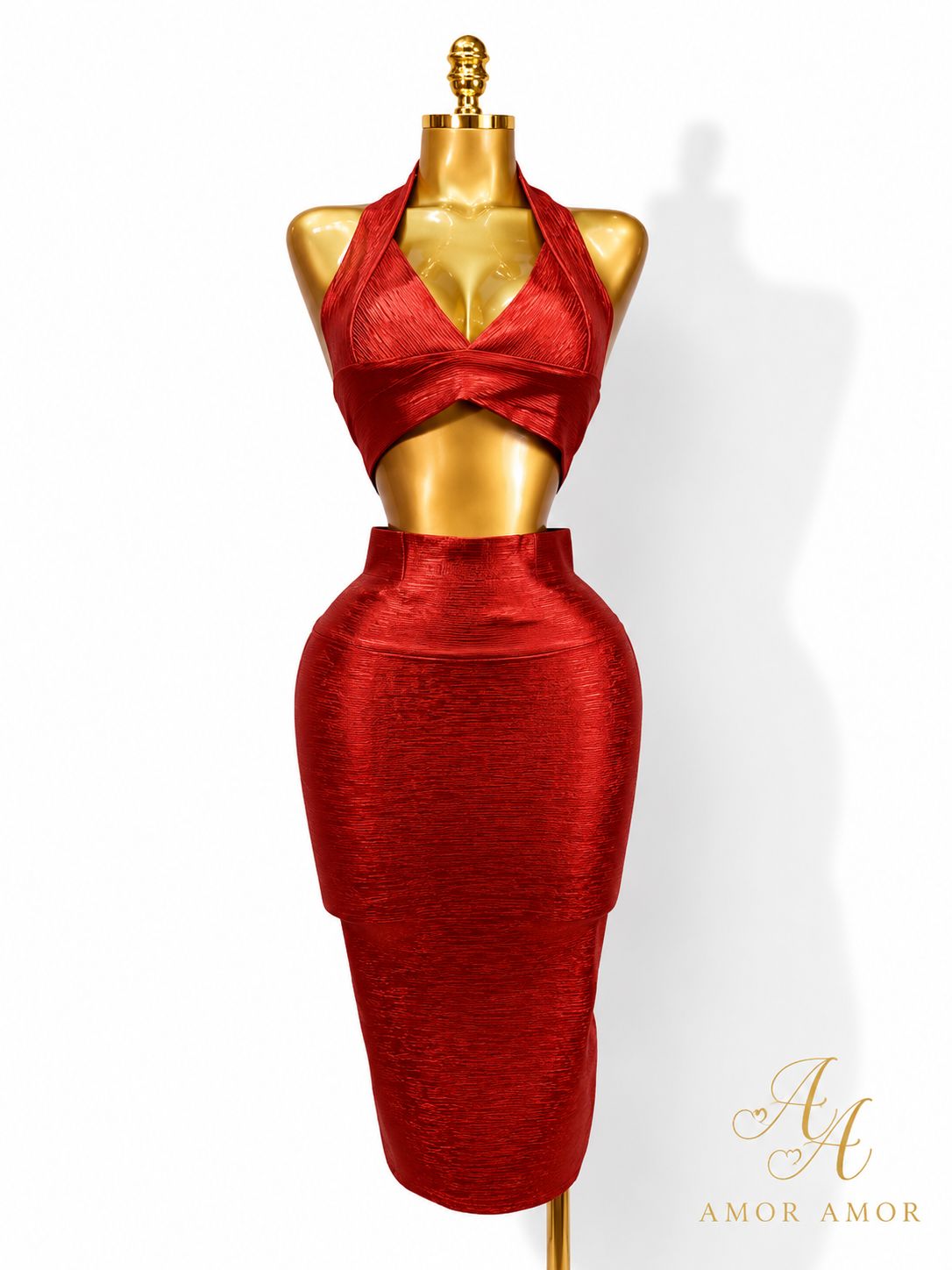 CONJUNTO EFECTO BRONCEADO 
TELA TIPO FAJA, AJUSTADO, ZIPER REFORZADOS