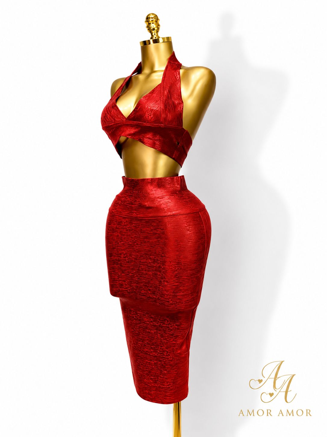 CONJUNTO EFECTO BRONCEADO 
TELA TIPO FAJA, AJUSTADO, ZIPER REFORZADOS
