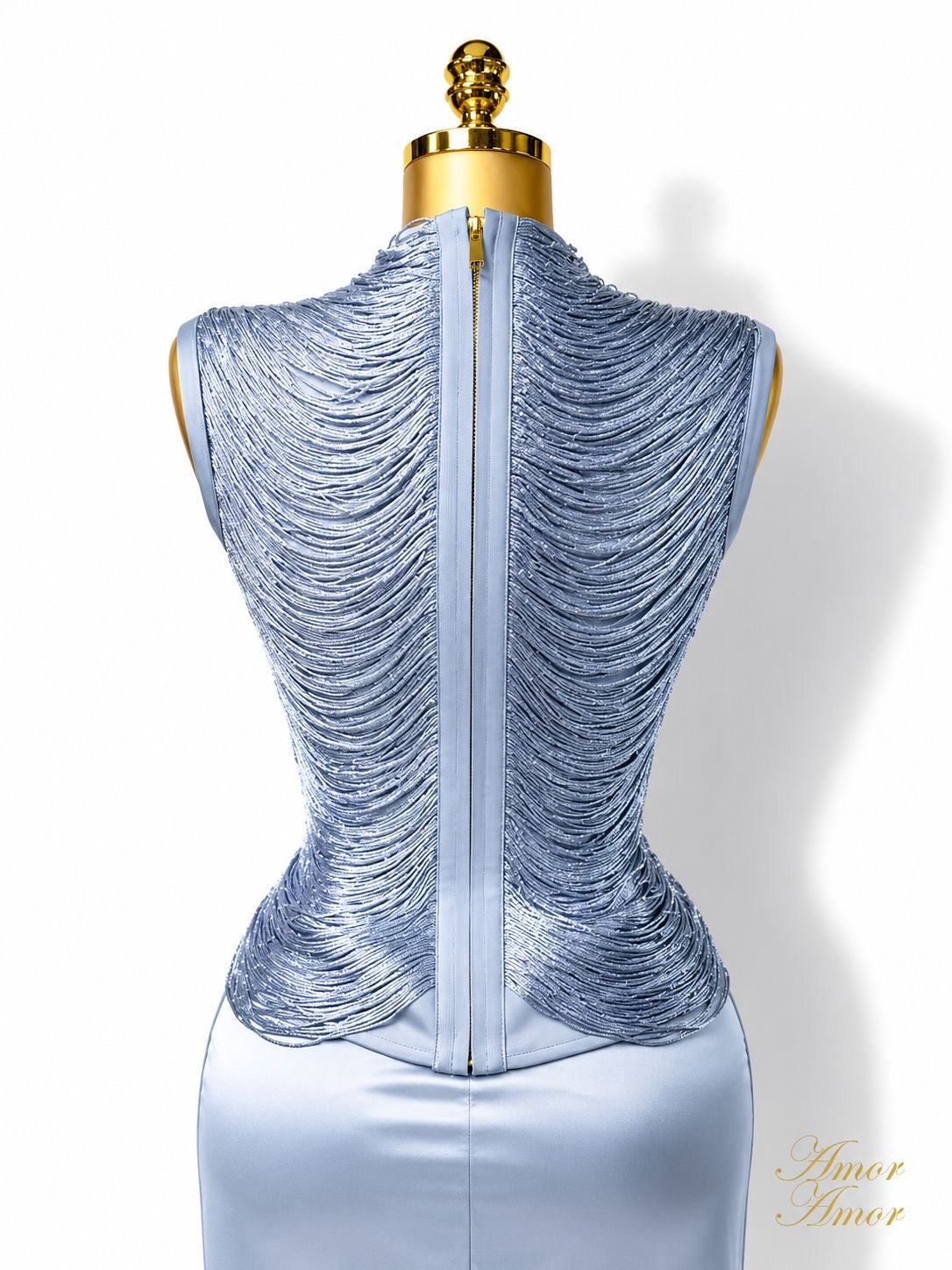 CONJUNTO FALDA LARGA, CINTURA ALTA, TOP BANDAGE DECORADO. ZIPER EN AMBAS PIEZAS