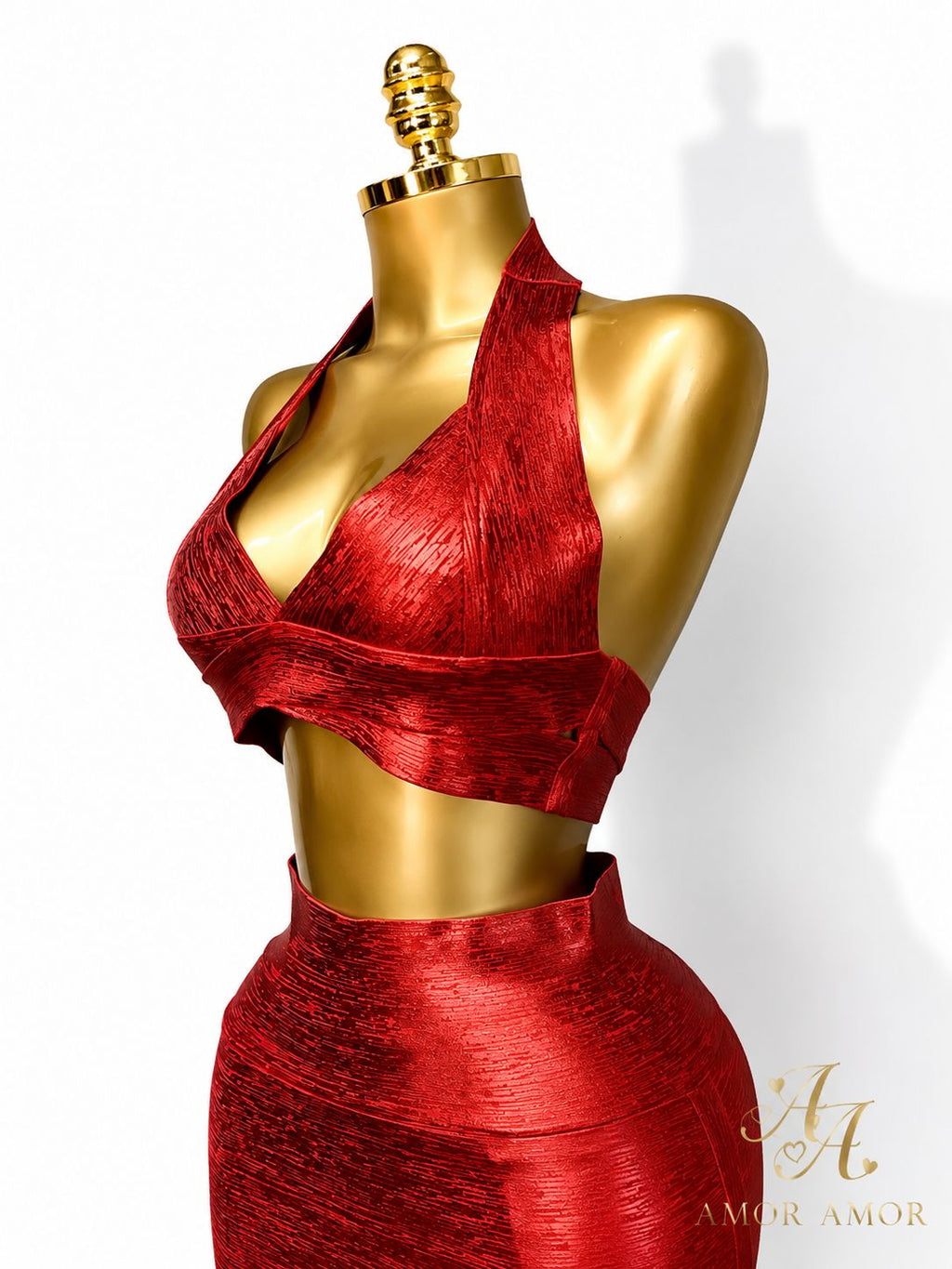 CONJUNTO EFECTO BRONCEADO 
TELA TIPO FAJA, AJUSTADO, ZIPER REFORZADOS